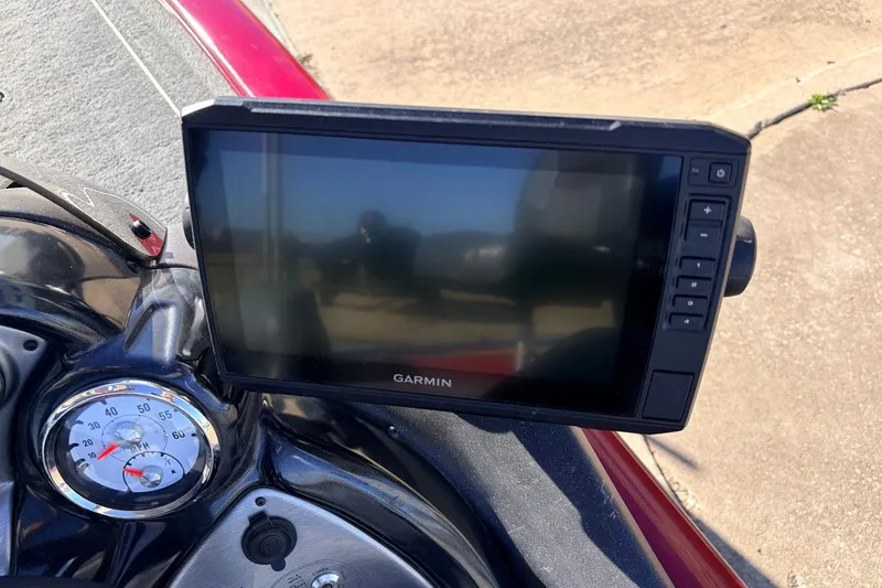 Slide: The Image of 2024 Tracker Pro Team 175 TXW boat dashboard with Garmin display and gauges. - 30