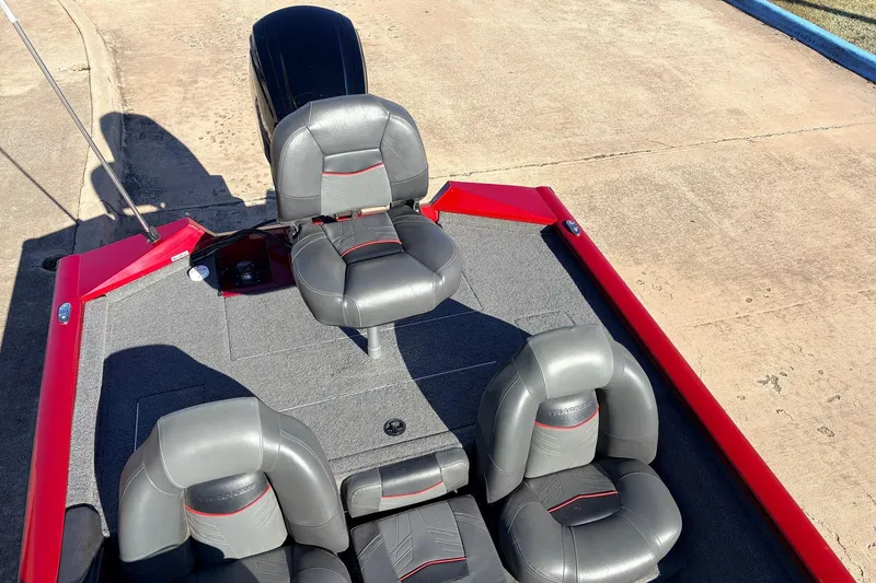 Slide: The Image of 2024 Tracker Pro Team 175 TXW boat interior with gray seating and red accents. - 33