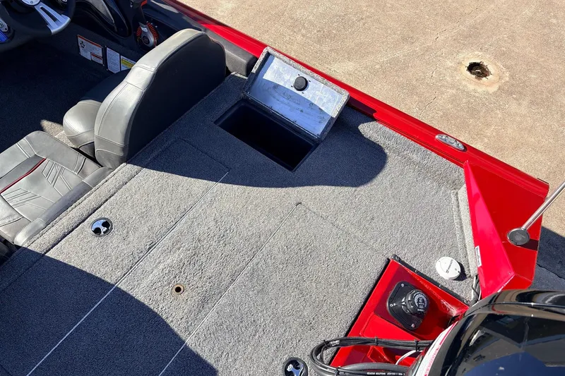 Slide: The Image of 2024 Tracker Pro Team 175 TXW boat interior with gray seating and red accents. - 39