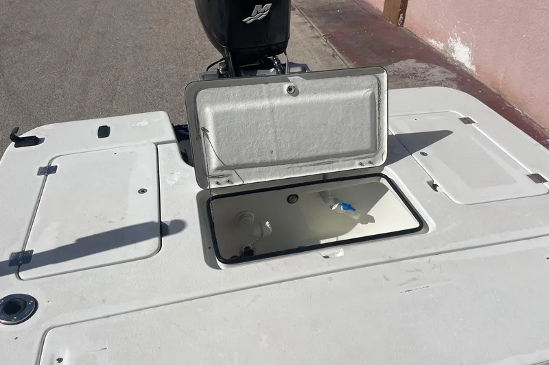 Slide: The Image of Open storage compartment on 2002 Action Craft 1802 boat deck. - 10