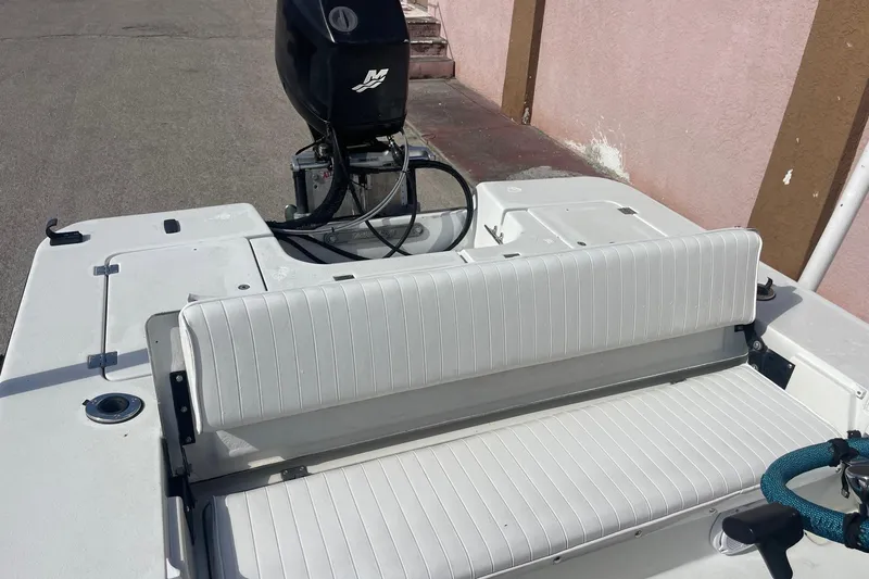 Slide: The Image of 2002 Action Craft 1802 boat with white seating and outboard motor. - 9