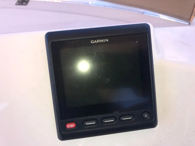Slide: The Image of Garmin display on 2016 Cutwater 30 Command Bridge boat dashboard. - 16