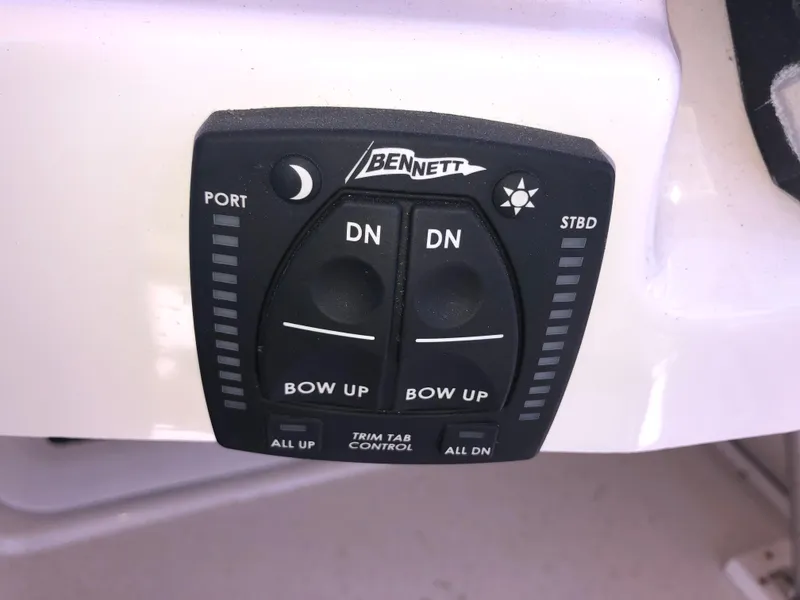 Slide: The Image of Bennett trim tab control panel on 2016 Cutwater 30 Command Bridge boat. - 19
