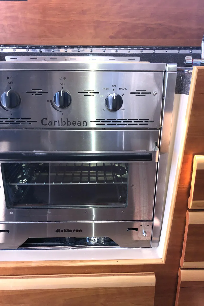 Slide: The Image of 2016 Cutwater 30 Command Bridge kitchen with stainless steel Caribbean oven. - 28