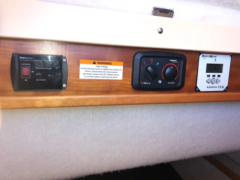 Slide: The Image of Control panel of a 2016 Cutwater 30 Command Bridge boat with warning label. - 44