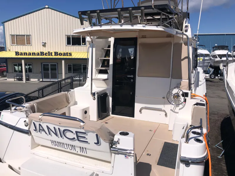 Slide: The Image of 2016 Cutwater 30 Command Bridge boat at BananaBelt Boats dealership, rear view. - 5