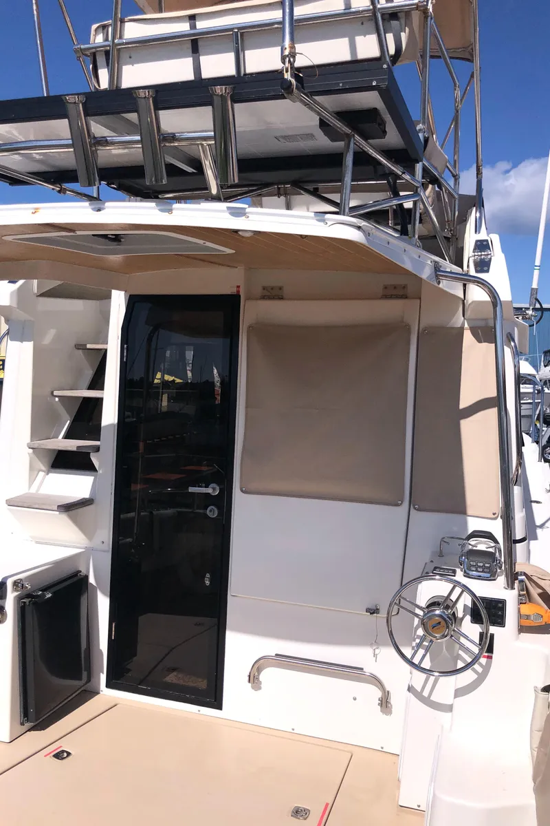 Slide: The Image of 2016 Cutwater 30 Command Bridge boat with upper deck and helm station. - 8