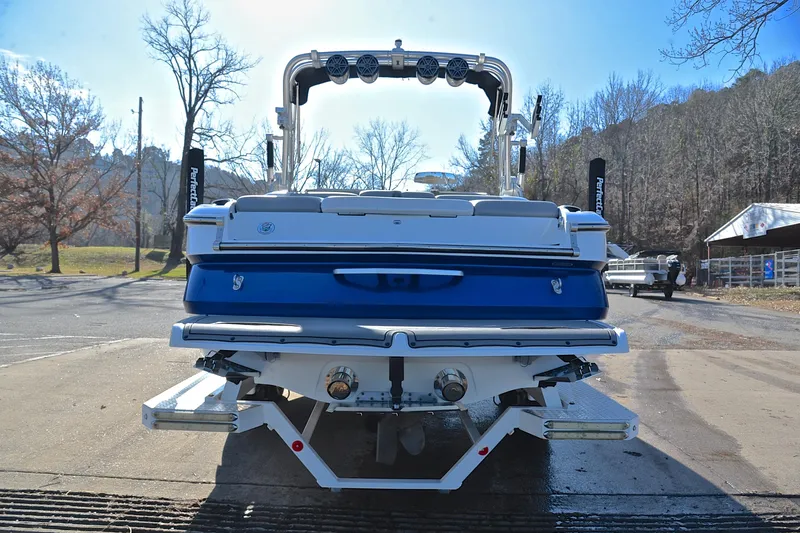Slide: The Image of 2013 MasterCraft X-35 boat on a trailer, rear view, outdoors. - 14