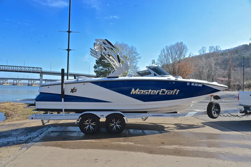 Slide: The Image of 2013 MasterCraft X-35 boat on trailer by riverside, ready for launch. - 16