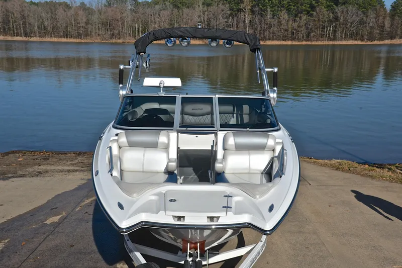 Slide: The Image of 2013 MasterCraft X-35 boat on a lakefront ramp, ready for launch. - 18