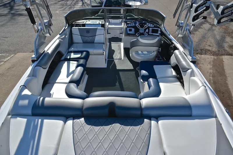 Slide: The Image of 2013 MasterCraft X-35 boat interior with luxurious seating and modern dashboard. - 19