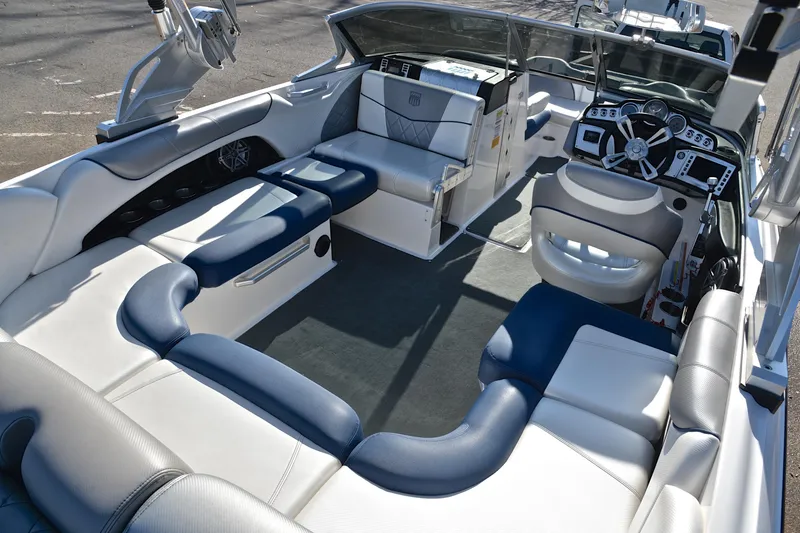 Slide: The Image of 2013 MasterCraft X-35 boat interior with luxurious seating and modern dashboard. - 20
