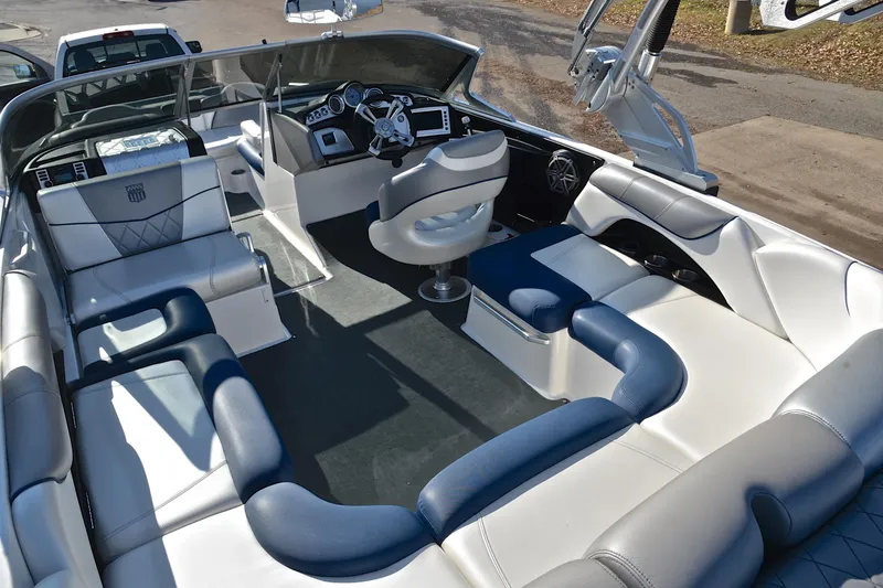 Slide: The Image of 2013 MasterCraft X-35 boat interior with luxurious seating and modern dashboard. - 24