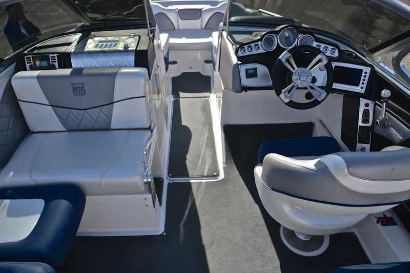 Slide: The Image of 2013 MasterCraft X-35 boat interior with modern dashboard and luxurious seating. - 25