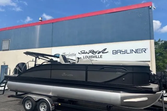 The Image of 2026 Barletta C22UC pontoon boat on trailer at dealership, Louisville. - 0