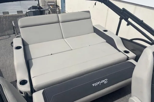 Slide: The Image of Luxurious seating on 2026 Barletta C22UC pontoon boat with cup holders and sleek design. - 11