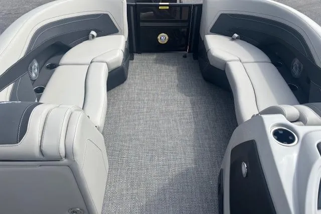 Slide: The Image of 2026 Barletta C22UC boat interior with gray seating and carpeted flooring. - 5