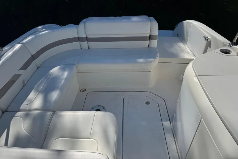 Slide: The Image of 2001 Formula 260 Sun Sport boat interior with white cushioned seating. - 12