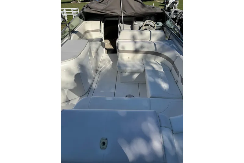 Slide: The Image of 2001 Formula 260 Sun Sport boat interior with white seating and steering wheel. - 14