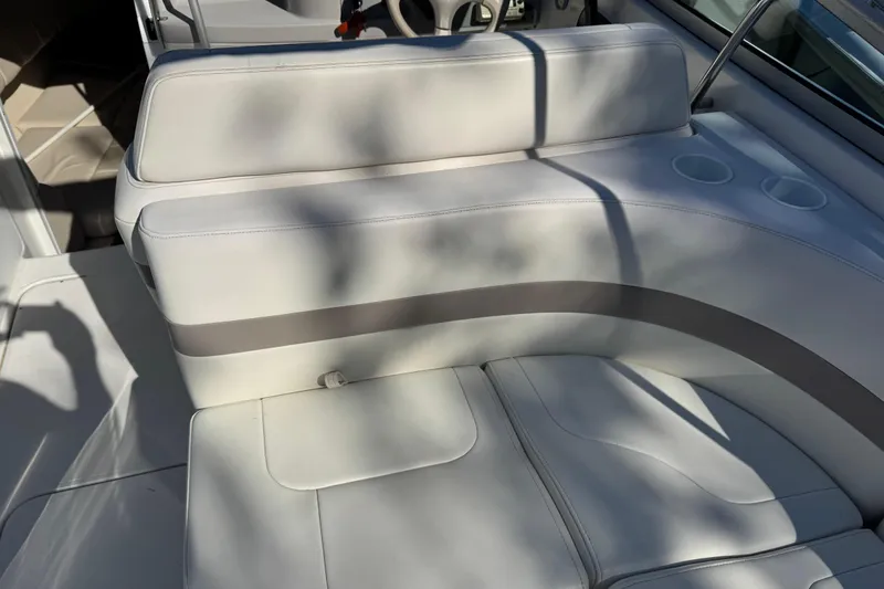 Slide: The Image of 2001 Formula 260 Sun Sport boat interior with white leather seating and cup holders. - 17