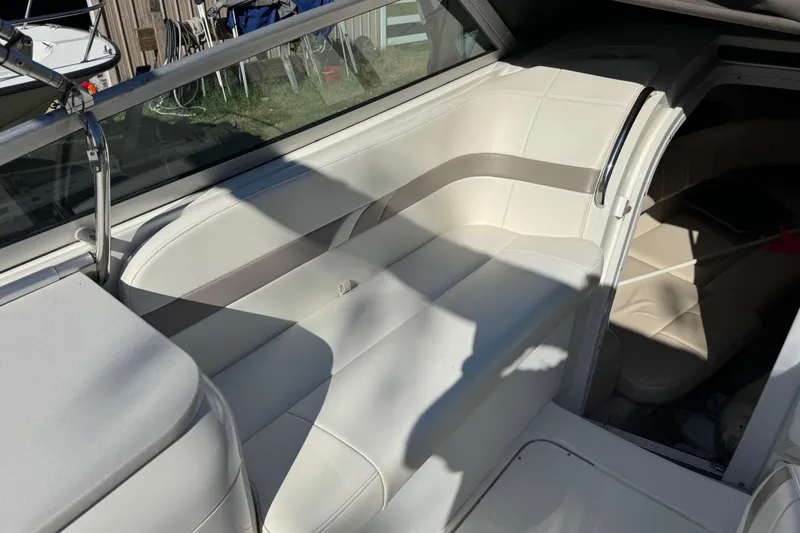Slide: The Image of 2001 Formula 260 Sun Sport boat interior with white seating and cabin entrance. - 18