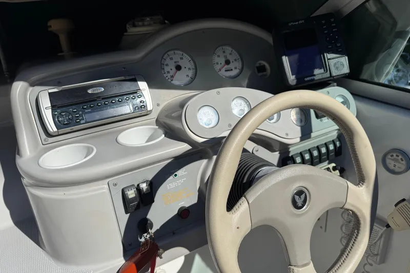 Slide: The Image of 2001 Formula 260 Sun Sport dashboard with steering wheel and control panel. - 19