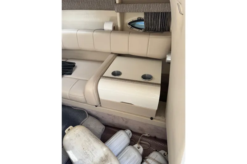Slide: The Image of Interior of 2001 Formula 260 Sun Sport boat with beige seating and cup holders. - 23