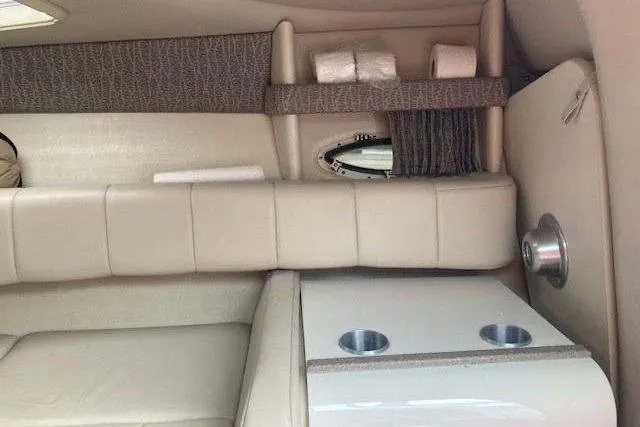 Slide: The Image of 2001 Formula 260 Sun Sport interior with beige seating and cup holders. - 24