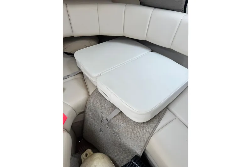 Slide: The Image of Interior seating of 2001 Formula 260 Sun Sport boat with white cushions. - 25