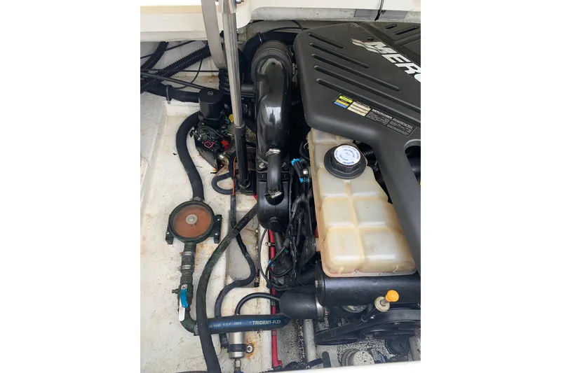 Slide: The Image of Engine compartment of a 2001 Formula 260 Sun Sport boat, featuring a MerCruiser engine. - 30