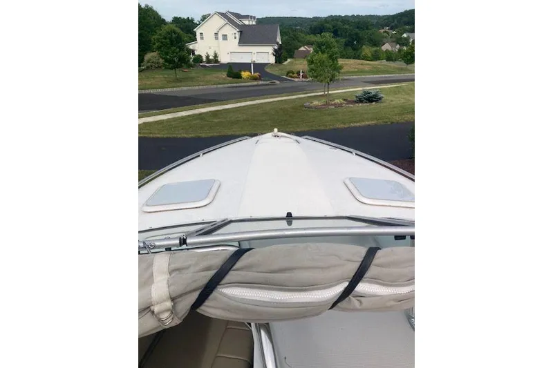 Slide: The Image of 2001 Formula 260 Sun Sport boat parked in a residential driveway. - 4