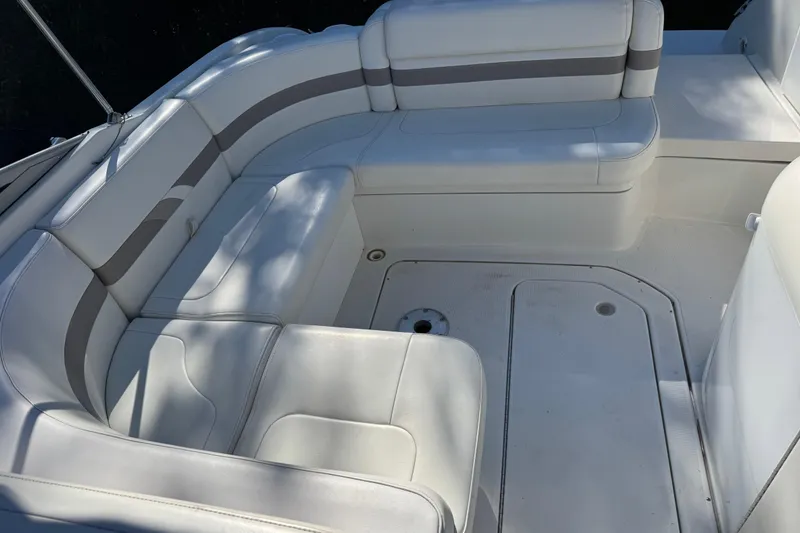 Slide: The Image of 2001 Formula 260 Sun Sport boat interior with white cushioned seating. - 5