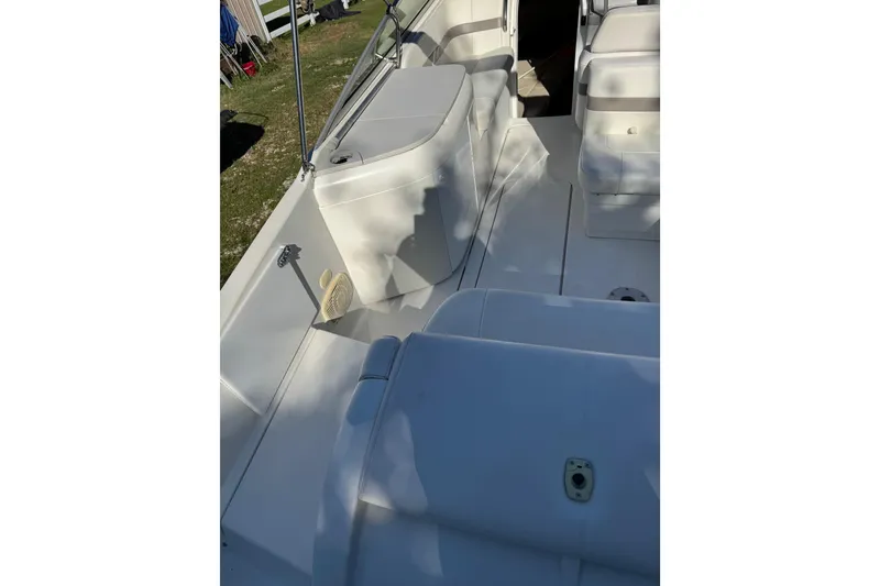 Slide: The Image of 2001 Formula 260 Sun Sport boat interior with white seating and deck. - 8