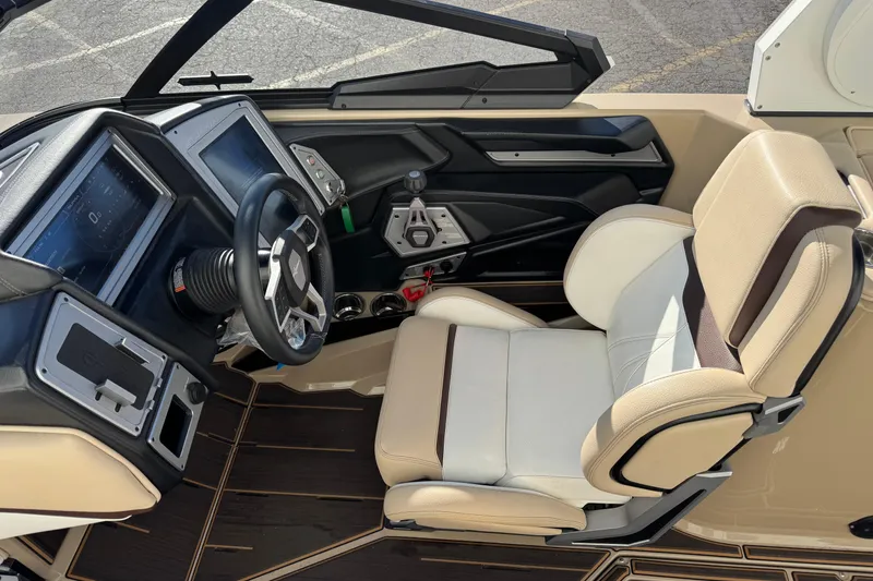 Slide: The Image of 2023 Supra SL 575 boat interior with modern dashboard and comfortable seating. - 7