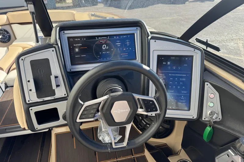 Slide: The Image of 2023 Supra SL 575 boat dashboard with advanced digital controls and steering wheel. - 8
