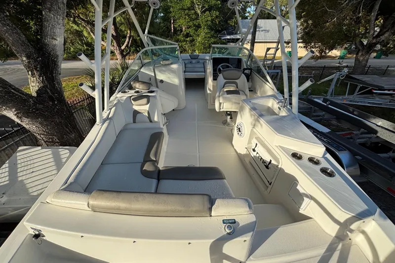 Slide: The Image of 2021 World Cat 230 SD boat interior with seating and steering console. - 10