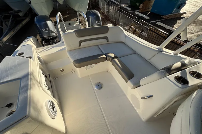 Slide: The Image of 2021 World Cat 230 SD boat interior with seating and dual Yamaha 115 engines. - 11