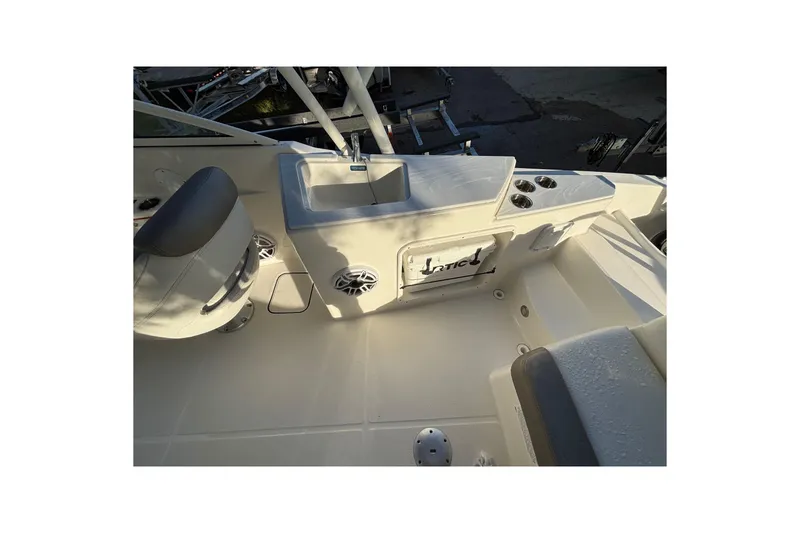 Slide: The Image of Interior view of 2021 World Cat 230 SD boat, featuring seating and storage areas. - 12