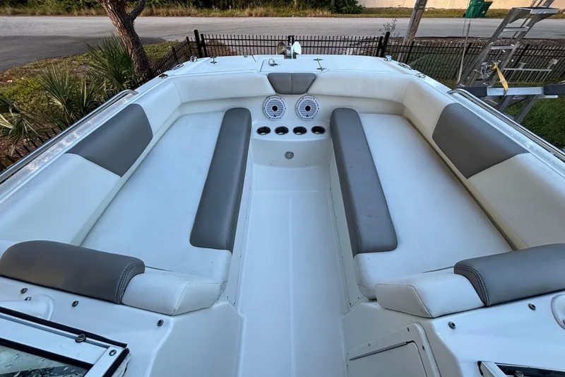Slide: The Image of Interior of 2021 World Cat 230 SD boat with cushioned seating and cup holders. - 17