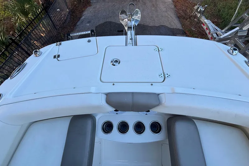 Slide: The Image of 2021 World Cat 230 SD boat interior with seating and storage compartments. - 18