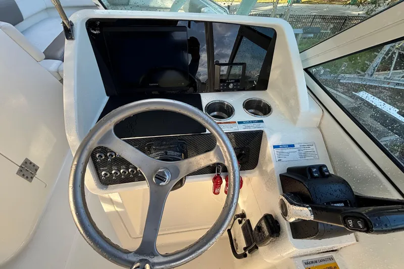 Slide: The Image of Steering console of 2021 World Cat 230 SD boat with controls and display. - 7