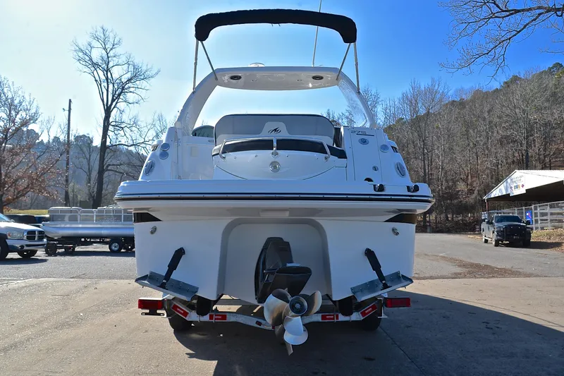 Slide: The Image of 2018 Monterey 275 Sport Yacht, rear view, parked outdoors on a trailer. - 16