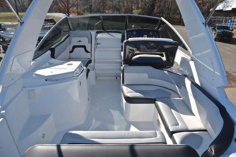 Slide: The Image of 2018 Monterey 275 Sport Yacht interior with sleek seating and modern dashboard. - 21