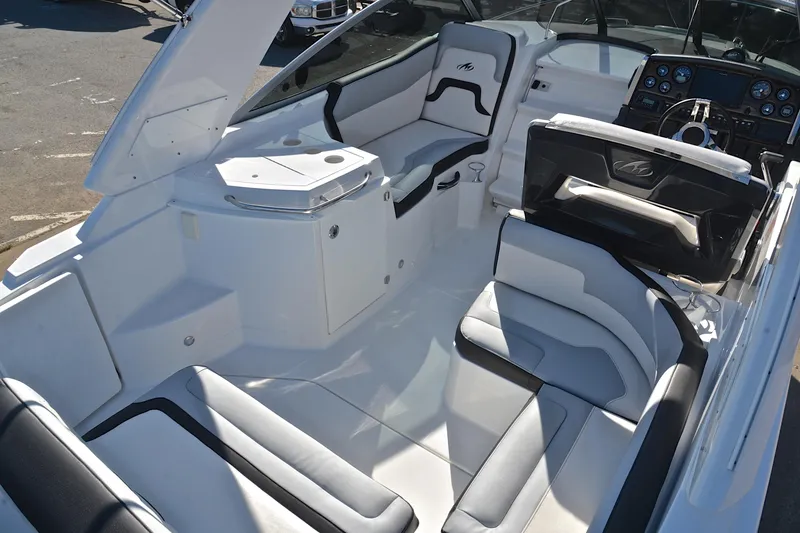 Slide: The Image of 2018 Monterey 275 Sport Yacht interior with sleek seating and modern dashboard. - 22