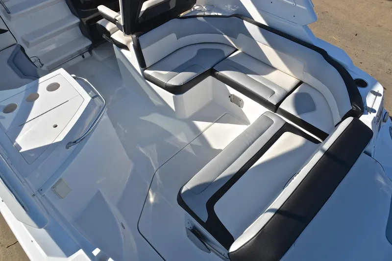 Slide: The Image of 2018 Monterey 275 Sport Yacht interior with sleek white seating and modern design. - 23