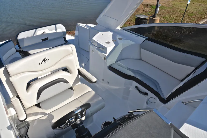 Slide: The Image of 2018 Monterey 275 Sport Yacht interior with sleek seating and modern helm design. - 27