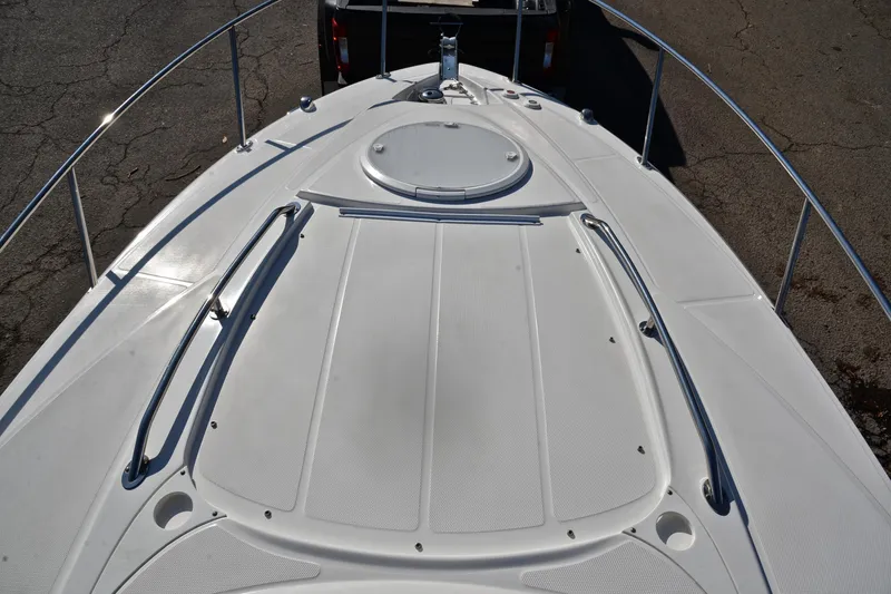 Slide: The Image of 2018 Monterey 275 Sport Yacht bow deck with railing and hatch. - 32