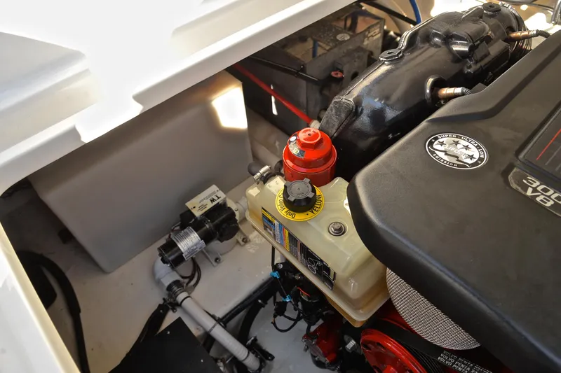 Slide: The Image of Engine compartment of a 2018 Monterey 275 Sport Yacht, showcasing mechanical components. - 39