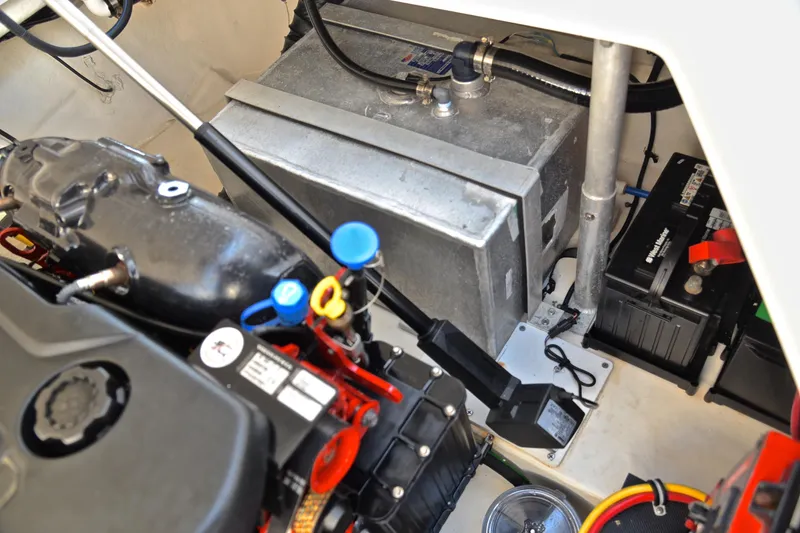 Slide: The Image of Engine compartment of a 2018 Monterey 275 Sport Yacht, showcasing battery and mechanical components. - 40