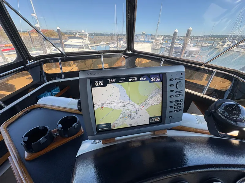 Slide: The Image of Helm of 1988 Carver 36 Aft Cabin with GPS navigation system in marina. - 14